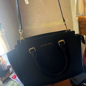 Women's Coach, Michael kors,rosetti, guess and a different assortment of purses